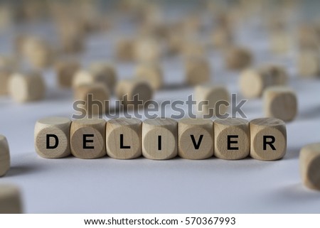 deliver - cube with letters, sign with wooden cubes