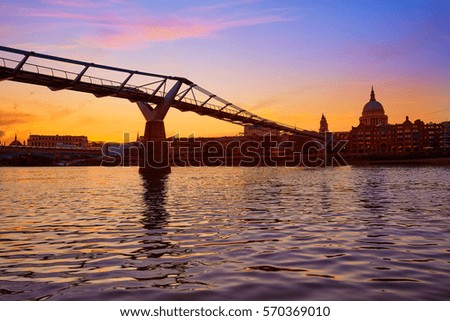 London Millennium bridge sunset skyline in UK at dusk