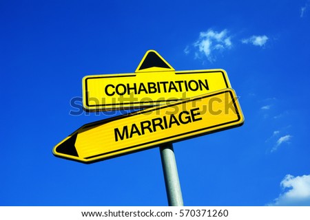 Cohabitation vs Marriage - Traffic sign with two options - unofficial couple living together vs married wife and husband as official partners