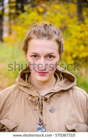Portrait of happy smiling beautiful young girl in autumn nature - wallpaper full of happiness