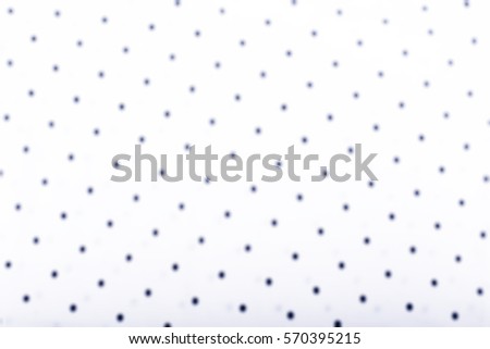 Blurred cotton texture, black dots on white