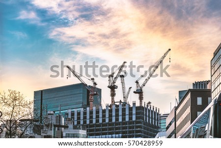 High rise building under construction in evening sky