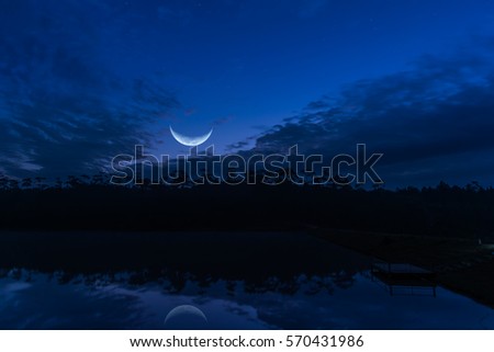 moon and silhouette tree with cloudy sky image.