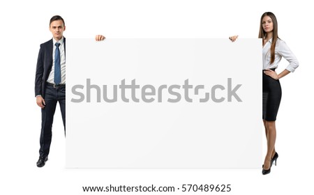 Businessman and businesswoman are holding both sides of a blank banner isolated on white background. Teamwork concept. Advertising and promotion. Presentations