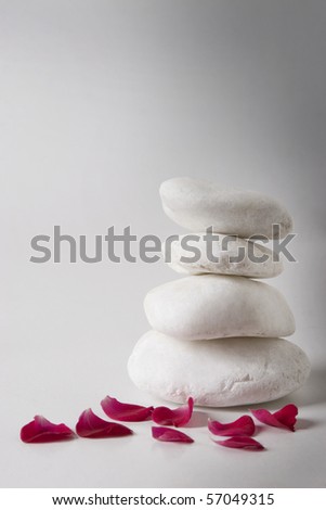 red petals and white pebbles, relaxation and meditation concept