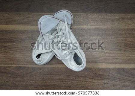 old shoes on wooden table,