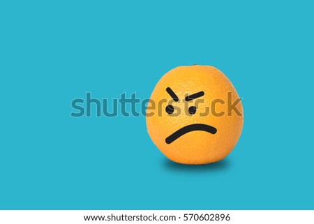 Orange face angry on blue background.