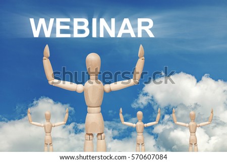 Wooden dummy puppet on sky background with word WEBINAR. Abstract conceptual image.