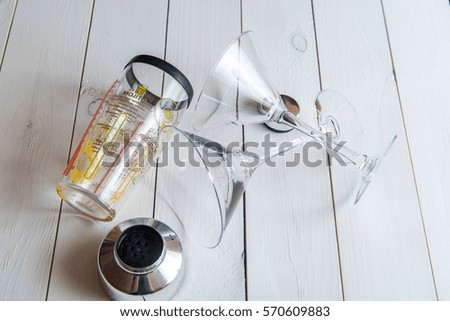 martini and shaker on wooden background