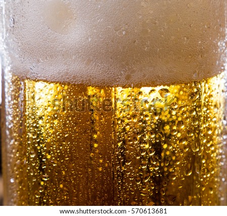 alcohol drink beer on macro picture with sparkles and foam useful for background