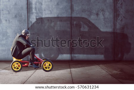 Ambitious Businessman on a pedal car Royalty-Free Stock Photo #570631234
