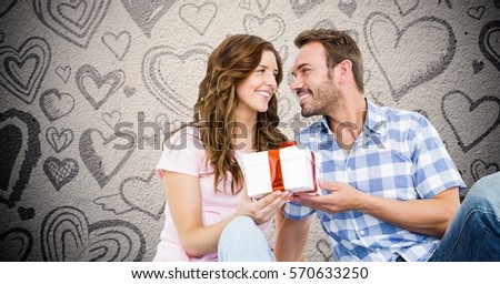 Composite image of man giving gift to woman