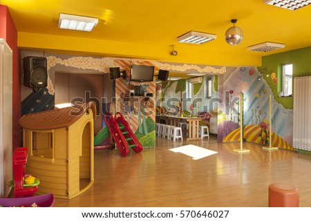 A day care center for children with mottled walls and lots of toys Royalty-Free Stock Photo #570646027