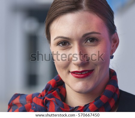 Young caucasian attractive stewardess portrait with smile in blue dress