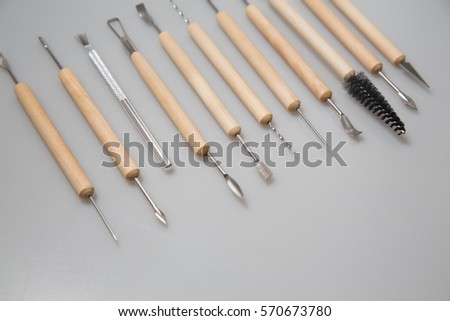 The wooden pottery , sculpting tools. Equipment for craft work on white background.