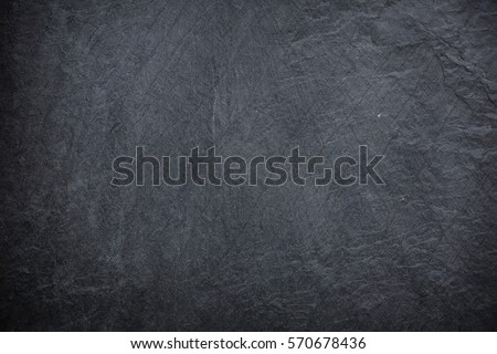 Dark grey and black slate background or texture Royalty-Free Stock Photo #570678436