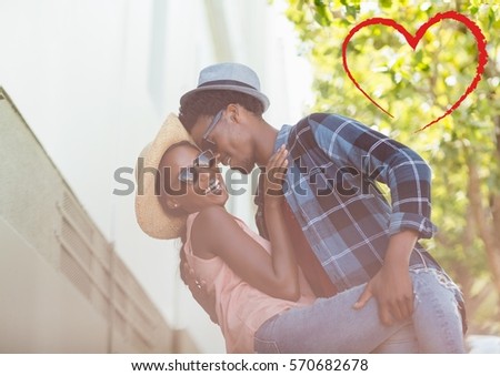 Composite image of red heart and romantic couple dancing on holidays