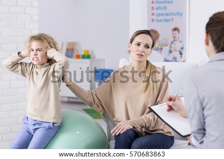 Problem child and desperate mother at psychological centre Royalty-Free Stock Photo #570683863