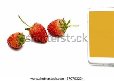 Strawberries, fresh berries and smart-phone isolated on white background