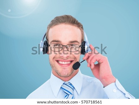 Portrait of smiling businessman with headset in office against digitally generated background