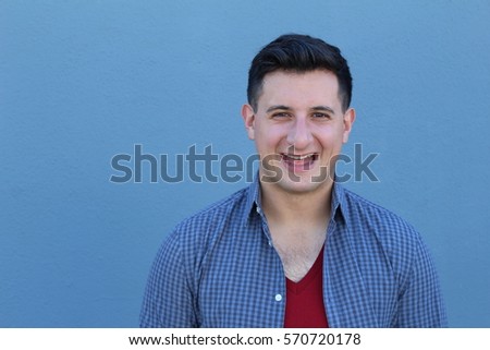 Excited guy against blue background - Stock image