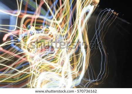 Colorful light line at night in dark room and copy space. Abstract of this image is fun and fancy imagination