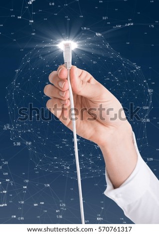 Hand of woman holding cable with flare against digitally generated background