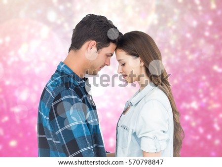 Composite image of romantic couple embracing each other against bokeh background