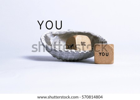 You can be you. An inspirational message set against a peaceful background with a seashell.