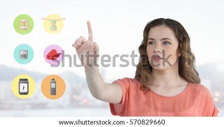 Beautiful woman touching digitally generated application icons
