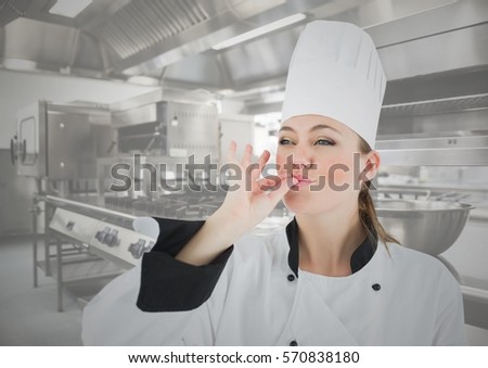Close-up of female chef tasting food in kitchen