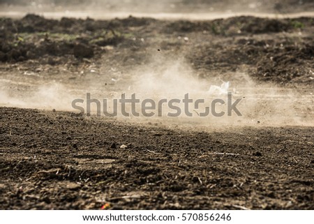 dirt fly after motocross roaring by