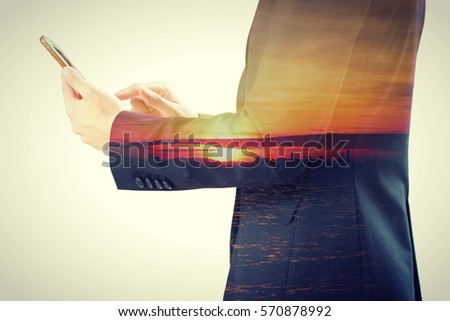 businessman using the smartphone and waiting for the holidays