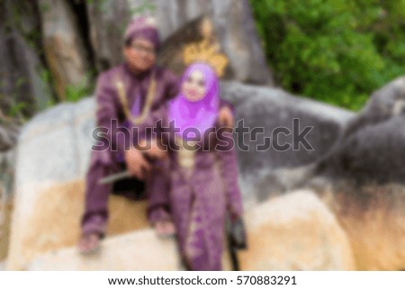A romantic and lovely malaysian wedding couple with motion blur effect.