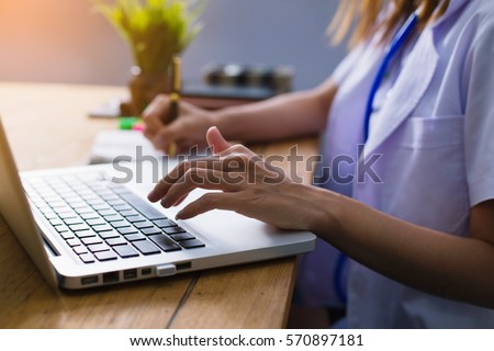 Doctor are using a computer or tablet, find information on Internet for medicinal purposes.
Doctor communication with patients via the Internet. Royalty-Free Stock Photo #570897181