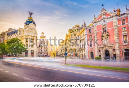 Downtown Madrid, Spain, where the Calle de Alcala meets the Gran Via. These are some of the most famous and busy streets in Madrid. Royalty-Free Stock Photo #570909121
