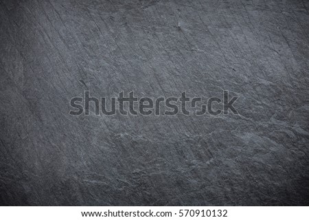Dark grey and black slate background or texture Royalty-Free Stock Photo #570910132