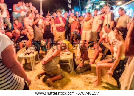 Blur background of People arm-wrestle activity in Full moon party at Phangan Island,  Thailand, Hang over in Thailand, Fight club, breaker activities game ,  team building 