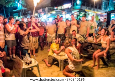Blur background of People arm-wrestle activity in Full moon party at Phangan Island,  Thailand, Hang over in Thailand,  American fight club, breaker activities game ,  team building 