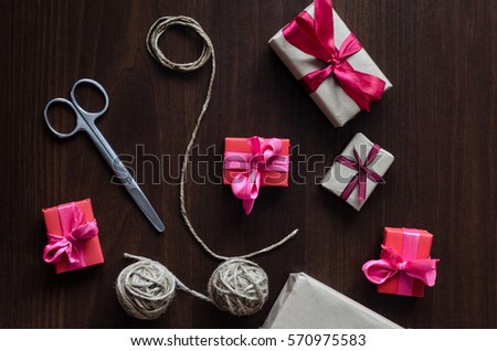Presents in kraft paper with red ribbons