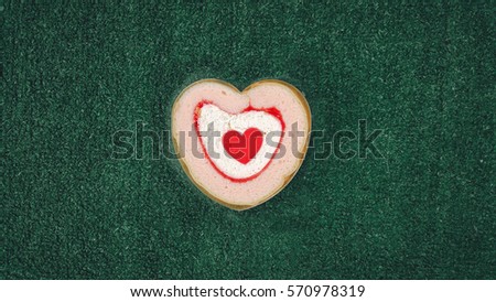 heart shaped shortbread valentine cookies . homemade cake In the form of heart with Stuffed jam blueberries and strawberries top view close up