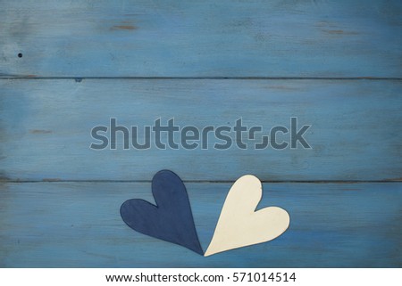 hand made white heart on a blue background, wood painted  Greek blue in vintage style