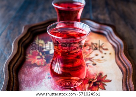 ottoman drink cranberry or rose sherbet in glass