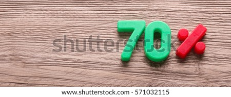 70% discount and empty space for text on a wooden background