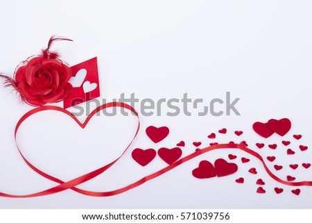 Red ribbon with hearts  on a white background