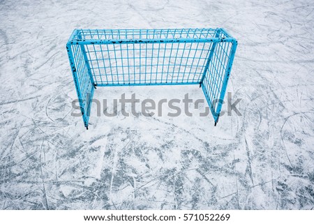 Hockey goal on an empty open air ice-ground