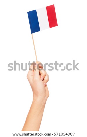 Small paper flag of France in woman's hand