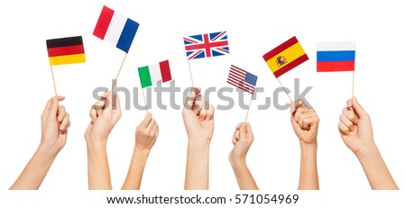Hands waving flags of USA and EU member-states Royalty-Free Stock Photo #571054969