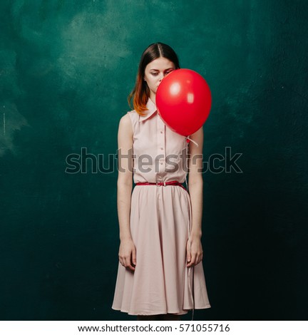 Sad upset girl with ball in hand.