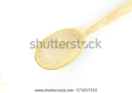 Large kitchen wooden spoon isolated on a white background. Selective focus.